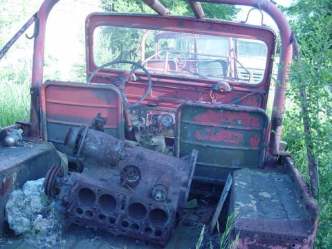 1992 Ford Bronco - This old jeep is in disrepair, with its engine block resting in the passenger compartment.