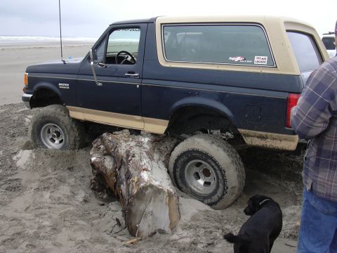 1991 Ford Bronco - This was my rock slider test. Sliders work great but I still had to be pulled off of the stump.