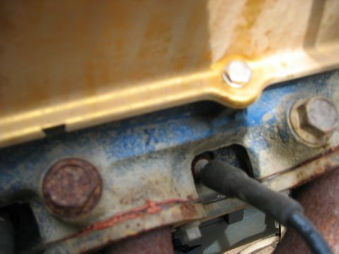 1978 Ford Bronco - Engine block detail showing a spark plug wire connection point.