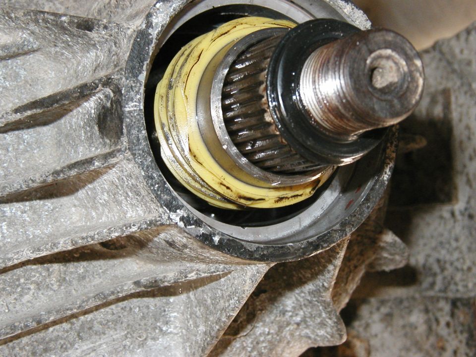 once the seal is out you can push out the rear output drive gear.  make sure the driven gear is taken out first though.
