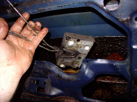 1986 Ford Bronco - When you pull this latch mechanism out you will lose one or two rods down the door. Use the previous photos to guide you on which way they…