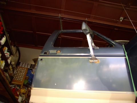 1986 Ford Bronco - Somebody at FullsizeBronco.com suggested bungee cording the doors to the ceiling to hold them while unbolting them. What a great idea, than…