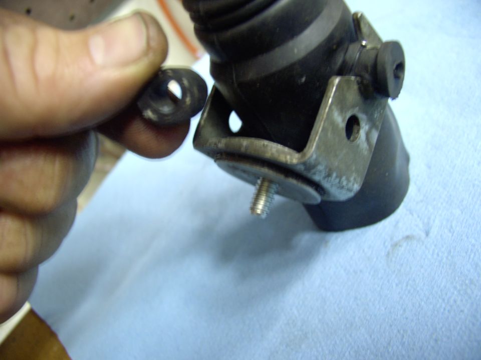 An old Austin trick. Stuff a piece of fuel hose between the actuator housing and the bolt to hold it still while you install it.  Leave it in or pull it out, your choice.