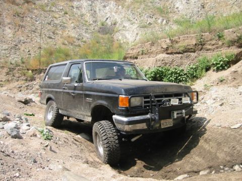 1988 Ford Bronco - This 1988 Ford Bronco is navigating a rocky, off-road trail with a winch mounted on the front bumper.
