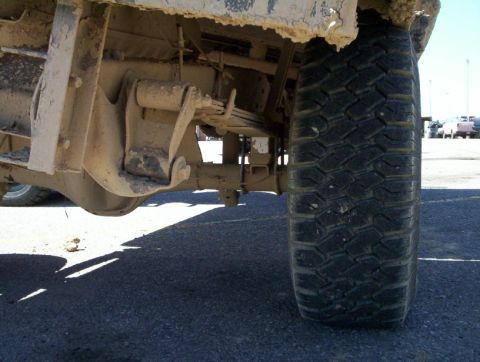 1978 Ford Bronco - This photo shows the underside of a vehicle, focusing on the rear axle and suspension components.