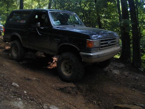 1988 Ford Bronco - This 1988 Ford Bronco is navigating a challenging off-road trail.
