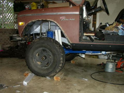 1995 Ford Bronco - This 1974 Ford Bronco shows significant suspension work with blue shocks and a custom blue sway bar.