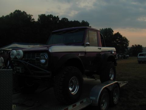 1988 Ford Bronco - A classic Ford Bronco is loaded onto a trailer at dusk.
