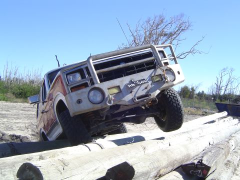 1982 Ford Bronco - This off-road SUV navigates a challenging obstacle course of logs.
