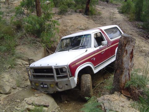 1982 Ford Bronco - This 1982 Ford Bronco is tackling a challenging off-road course with steep inclines and rocky terrain.