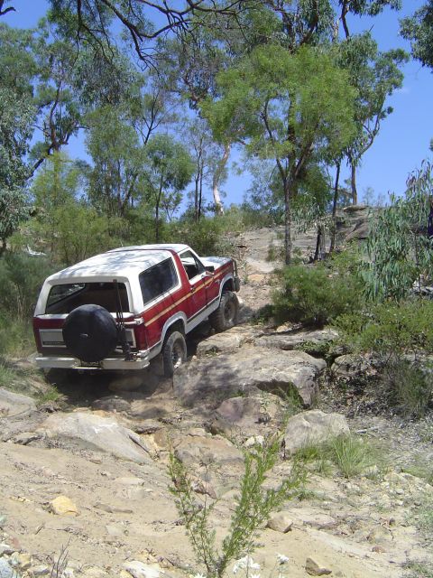 1982 Ford Bronco - This 1982 Ford Bronco navigates a challenging rocky terrain, its off-road capabilities.