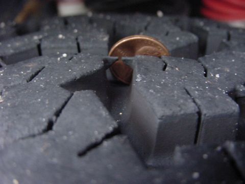 1989 Ford Bronco - Tire tread depth measured with a penny.