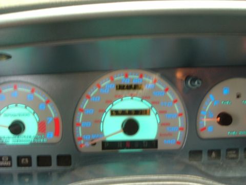 1993 Ford Taurus - The illuminated dashboard gauges show the vehicle's speed, RPM, and fuel level.