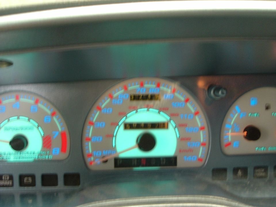 Car dashboard with speedometer, tachometer, and fuel gauge. Odometer reads 67371