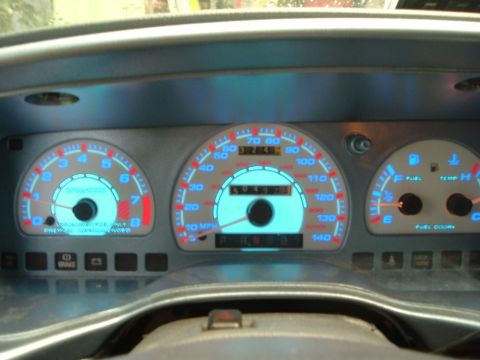 1993 Ford Taurus - Dashboard gauges with glowing blue illumination. Odometer shows 40,497 miles.