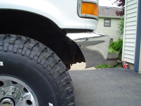 1993 Ford Bronco - This is a close-up of the front corner of a Ford F-Series truck, showing the tire and bumper.