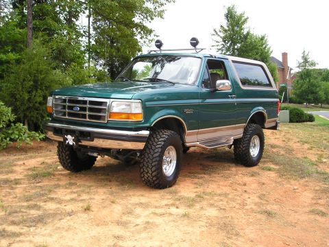 1996 Ford Bronco - This lifted 1996 Ford Bronco is shown in a three-quarter front view, parked outdoors.