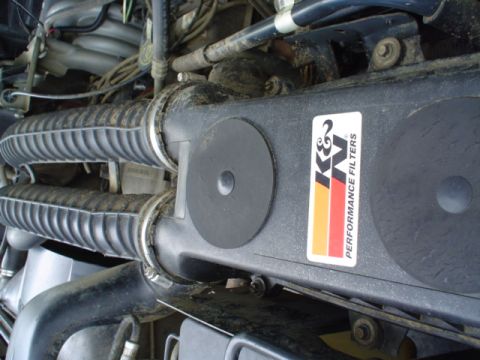 1993 Ford Bronco - Close-up of an engine bay, a K&N Performance Filters sticker on the air intake system.