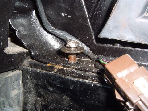 1993 Ford Bronco - Detail of wiring and mounting hardware, likely from a vehicle's engine bay or chassis.
