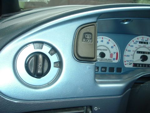 1993 Ford Taurus - Interior view of a 1993 Ford Taurus dashboard, showing light controls and instrument cluster.
