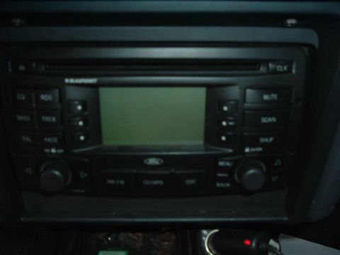 1993 Ford Taurus - Close-up of a car's audio system, showing the stereo unit and its controls.