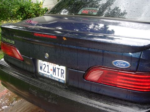 1993 Ford Taurus - Rear view of a 1993 Ford Taurus, showing the Taurus badging and Ford emblem on the trunk lid.