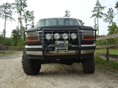 1993 Ford Bronco - This Ford truck, likely a 1992 model, is equipped with a heavy-duty front bumper and winch.
