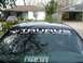 1993 Ford Taurus - A banner reading "TAURUS" is visible on the top of a car's windshield.