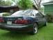 1993 Ford Taurus - Rear view of a dark blue 1993 Ford Taurus parked on grass.