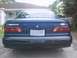 1993 Ford Taurus - Rear view of a 1993 Ford Taurus sedan, showing taillights and license plate area.
