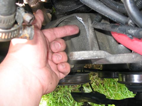 1989 Ford Bronco - another angle of where I am cutting out the metal. I eventually cut back all of the way to the rib on the alt. bracket so it isn't rounded…