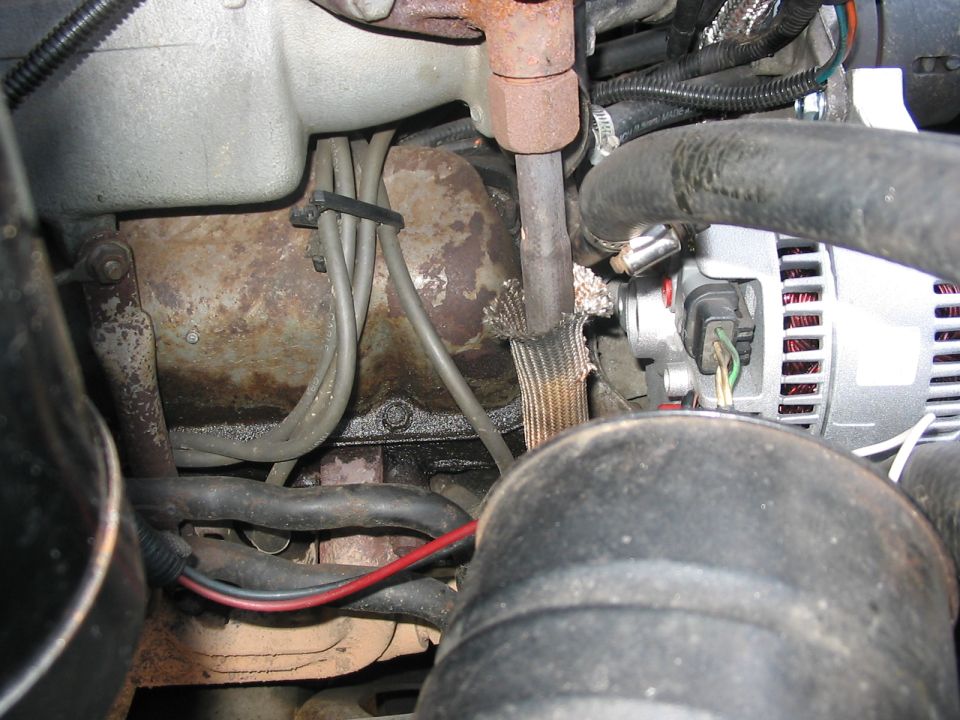 you can see how I rerouted all of the local wires away from the emissions pipe that comes up from the exhaust manifold.