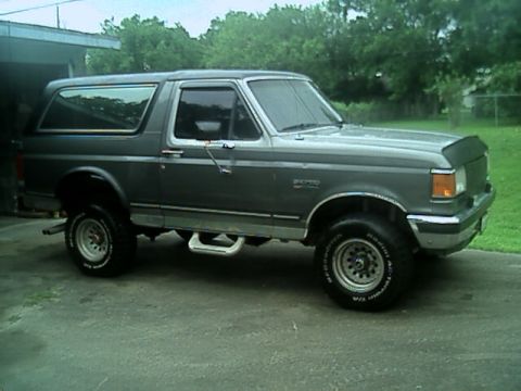 1989 Ford Bronco - This 1989 Ford Bronco is shown from a three-quarter front view, parked on a paved surface.