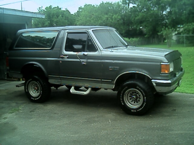 Gray 1989 Ford Bronco parked outside