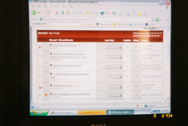 Computer screen displaying a forum thread list with various topics