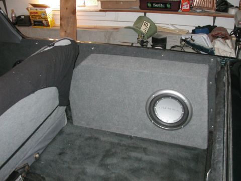 1994 Ford Bronco - A subwoofer is installed in the rear interior of a vehicle, next to the seating.
