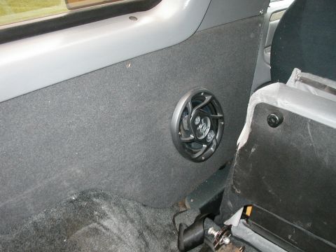 1994 Ford Bronco - Interior shot showing an aftermarket speaker installed on the side panel of a vehicle.
