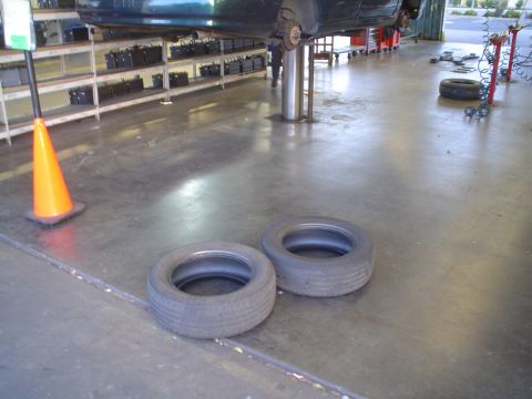 1993 Ford Taurus - the two left side tires.. these ones are technically "bald" but that's alright.. I'll keep them.