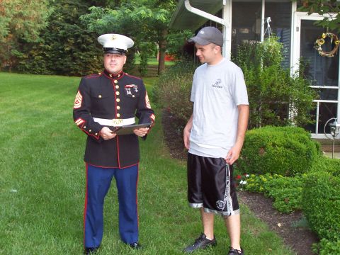 1994 Ford Bronco - Two men stand in a yard, one in a Marine uniform and the other in casual clothing.