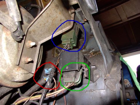 1986 Ford Bronco - This image shows a close-up view of various electrical connectors and wiring within a vehicle's engine compartment.