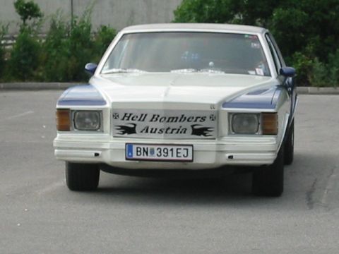 1992 Ford Crown Victoria - This sedan features a prominent decal on its front grille reading 'Hell Bombers Austria'.