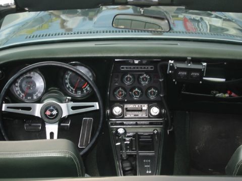 1992 Ford Crown Victoria - Interior view of a 1969 Corvette, the dashboard, steering wheel, and center console.