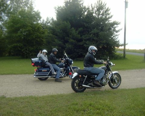 1985 Ford F-150 - Two motorcycles ride on a gravel path with riders wearing helmets.