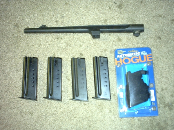 Gun barrel and four magazines, plus a Hogue grip in packaging