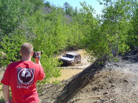 1993 Ford Bronco - A 1993 Ford Bronco navigates a muddy off-road course.