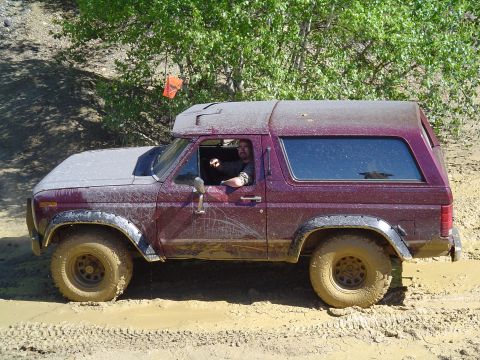1993 Ford Bronco - This Ford Bronco is navigating a muddy off-road course.