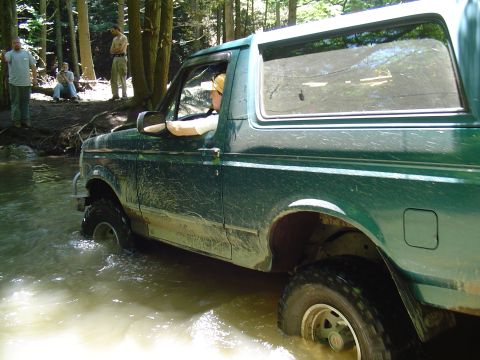 1993 Ford Bronco - This 1993 Ford Bronco is navigating a water crossing in a forest.