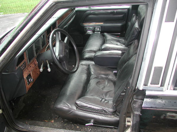 1987 Lincoln Town Car interior with leather seats and wood trim
