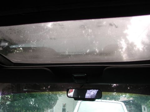 1987 Lincoln Town Car - View from inside a car, looking towards the sunroof and windshield, with a watermark present.