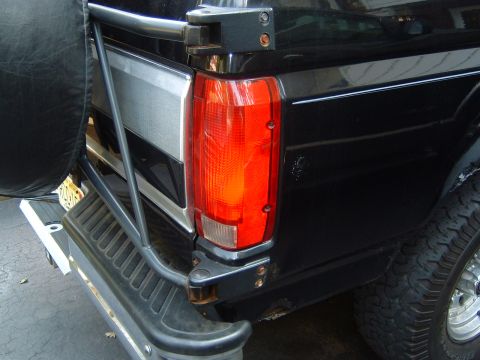 1993 Ford Bronco - Rear view of a 1993 Ford Bronco, showing the taillight and spare tire mount.